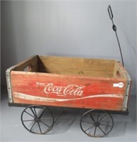 Metal wagon frame with wood Coca-Cola crate.