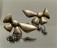 Pair of vintage bow style sterling silver earrings