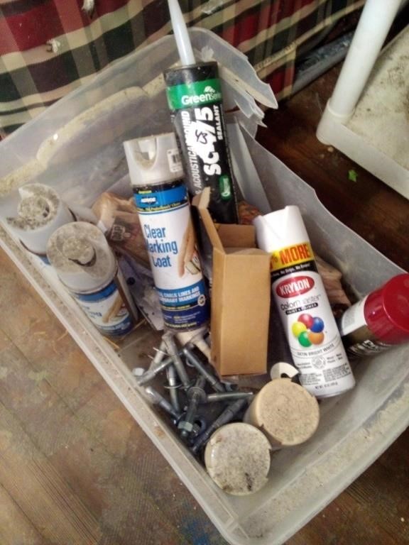 Tote of spray paint, clear marking coat, screws