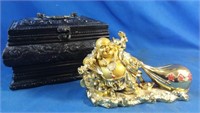 Oriental figurine and wooden chest