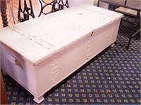 Vintage cedar chest with metal straps,