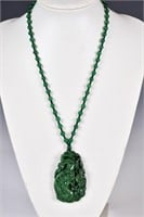 A Spinach Green Stone Carved Dragon Necklace