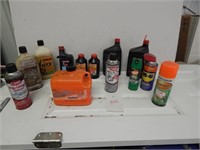 jug of orange hand cleaner, oil, 2-cycle, brake