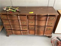 Eight drawer dresser with some facial damage. 59