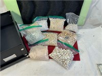 9 BAGS OF PEARL BEADS SORTED BY SIZE