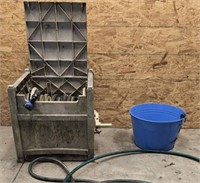 Hose box with hose, blue metal bucket, hose