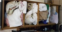 Shelf with contents, towels and sheets