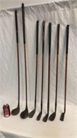 Selection of antique golf clubs