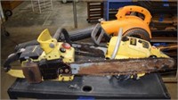 Two Gas Powered Chainsaws And A Gas