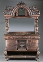 Heavily carved mirrored back sideboard w/ griffins