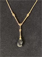 Lady’s 14K necklace with amethyst color pendant.