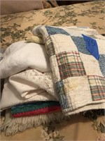 Stack of assorted quilts