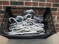 Crate full of Plastic Clothes Hangers
