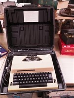 Portable Sears electric typewriter marked The