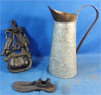 Cast iron wall hanging, shoe form & metal jug
