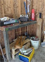Items On Top Of Workbench. Screen, Caulk Gun,