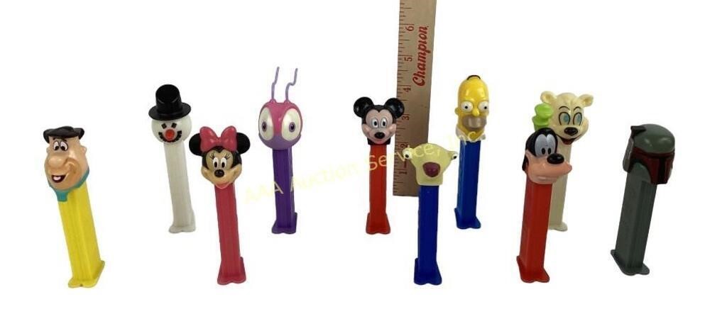 Pez dispensers. Polar bear, snowman,Fred, homer,