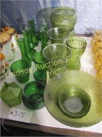 23 pcs of green glassware: bud vases, plates,
