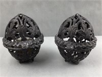 2 cast iron egg shaped candle holders