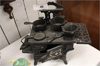 ANTIQUE CAST IRON CRESCEHT TOY STOVE