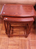 Two nesting oak end tables by Ethan Allen