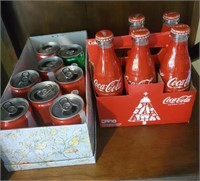 Coke bottles and cans on shelf