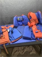 Two infant and two child life jackets  (at#26b)