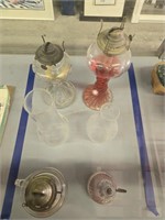 Four vintage oil lamps as shown