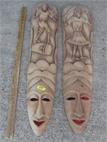 2 hand carved face/boy & girl decorative pieces