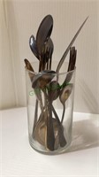 Older utensils in a glass vase.   1442