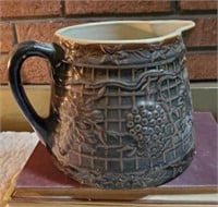 Stoneware pitcher w/ grape & leaf motif