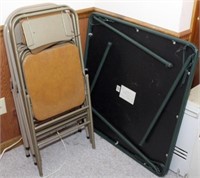 4 metal folding chairs; card table; pedestal fan