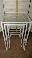 white metal and glass nesting end tables