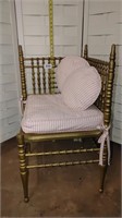 brass color corner seat with cushion