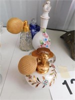 Five vintage perfume bottles: blown glass with