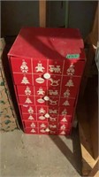 Red cardboard drawers filled with Christmas