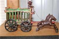 Old Cast iron wagon with two horses and driver