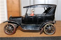 Antique tin prototype Ford Model A with driver