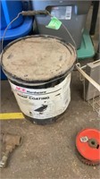 Bucket of roof coating