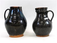 (2) redware handled pitchers. Early 19th century.