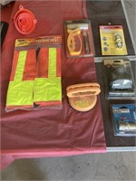 Different sizes of funnels, reflective vest,
