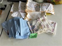Assorted embroidered towels and fancy linens