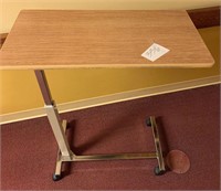 Rolling adjustable height medical bed table