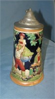 Vintage German beer stein features festive group o
