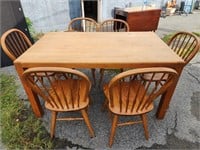Oak table and 5 bow back chairs.  60" L x 36" D.