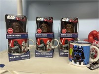 4 star wars collector mugs. all darth vador