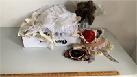 Assorted doll clothes, stands, accessories