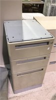 Three drawer metal file cabinet one is standard