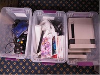Three containers of Wii games, game consoles,
