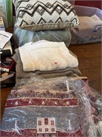 Decorative throws, rugs, pillows, etc.